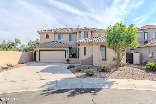 4389 E Muirfield St, Gilbert, AZ 85298 - mediterranean / spanish home featuring stucco siding, fence, a tile roof, an attached garage, and driveway