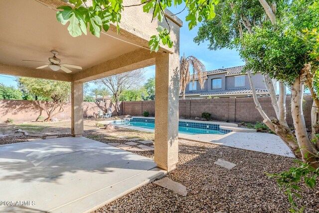 4389 E Muirfield St, Gilbert, AZ 85298 - view of patio / terrace with a fenced backyard, ceiling fan, and a fenced in pool
