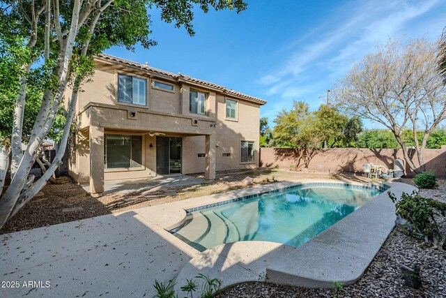 4389 E Muirfield St, Gilbert, AZ 85298 - back of property with a fenced in pool, stucco siding, a ceiling fan, a patio area, and a fenced backyard
