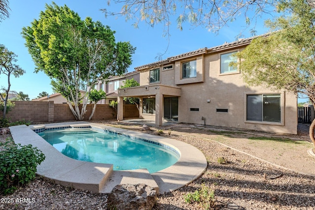 4389 E Muirfield St, Gilbert, AZ 85298 - back of property featuring a patio, a fenced backyard, a tiled roof, and stucco siding
