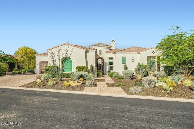 28609 N Cottonwood Basin Dr, Rio Verde, AZ 85263 - mediterranean / spanish home featuring a garage, a tile roof, stucco siding, and driveway
