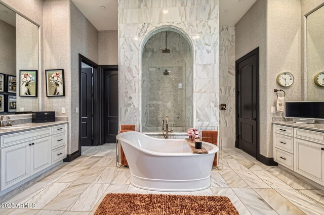 28609 N Cottonwood Basin Dr, Rio Verde, AZ 85263 - bathroom featuring a shower stall, a freestanding tub, two vanities, and marble finish flooring
