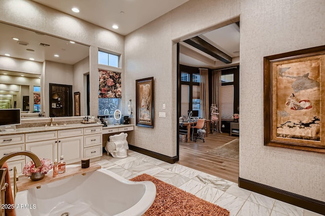 28609 N Cottonwood Basin Dr, Rio Verde, AZ 85263 - bathroom featuring vanity, a tub to relax in, baseboards, marble look tiles, and recessed lighting