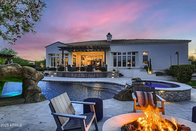 28609 N Cottonwood Basin Dr, Rio Verde, AZ 85263 - pool at dusk featuring a fire pit, a patio, and an outdoor pool