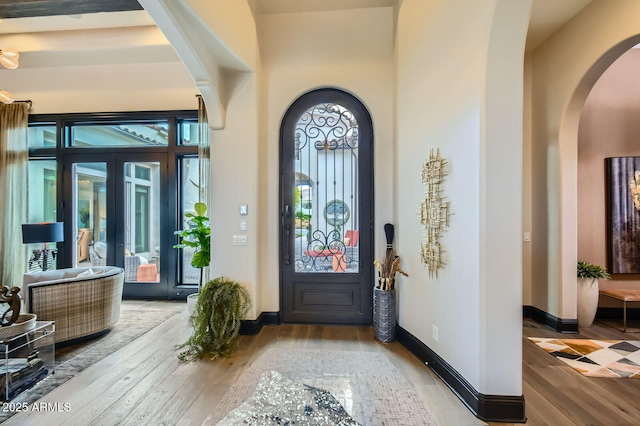 28609 N Cottonwood Basin Dr, Rio Verde, AZ 85263 - foyer featuring hardwood / wood-style flooring, french doors, healthy amount of natural light, and arched walkways