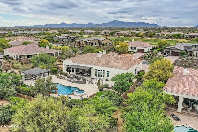 28609 N Cottonwood Basin Dr, Rio Verde, AZ 85263 - aerial perspective of suburban area with a pool area and a mountainous background