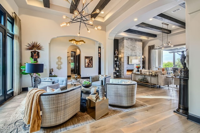 28609 N Cottonwood Basin Dr, Rio Verde, AZ 85263 - living area featuring arched walkways, coffered ceiling, beamed ceiling, light wood-type flooring, and recessed lighting