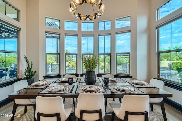 28609 N Cottonwood Basin Dr, Rio Verde, AZ 85263 - dining room with a chandelier, wood finished floors, and a high ceiling