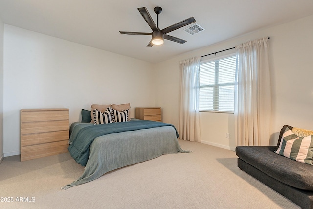 bedroom featuring visible vents, baseboards, a ceiling fan, and carpet flooring