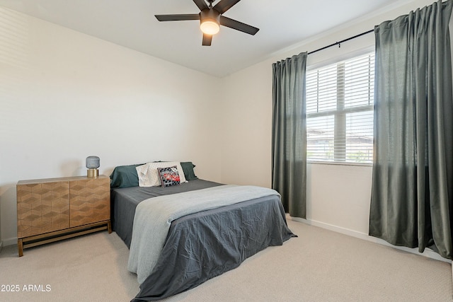 bedroom with baseboards, carpet floors, and ceiling fan