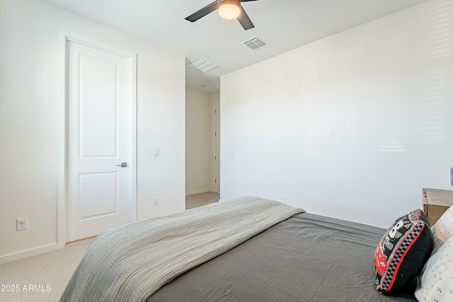 carpeted bedroom with baseboards, visible vents, and ceiling fan