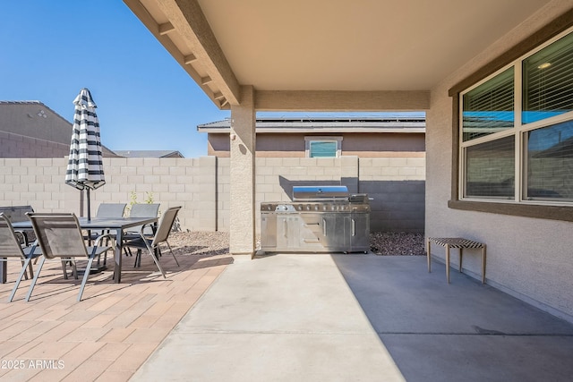 view of patio / terrace with outdoor dining area and fence