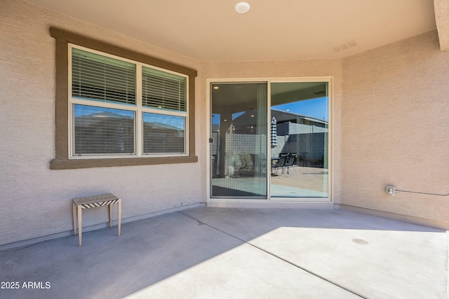 view of patio featuring visible vents