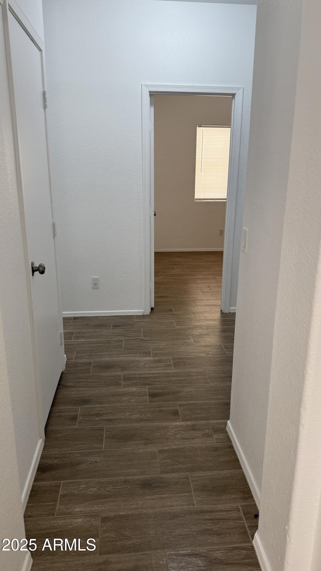 12505 W Adams St, Avondale, AZ 85323 - corridor featuring dark wood-style floors and baseboards