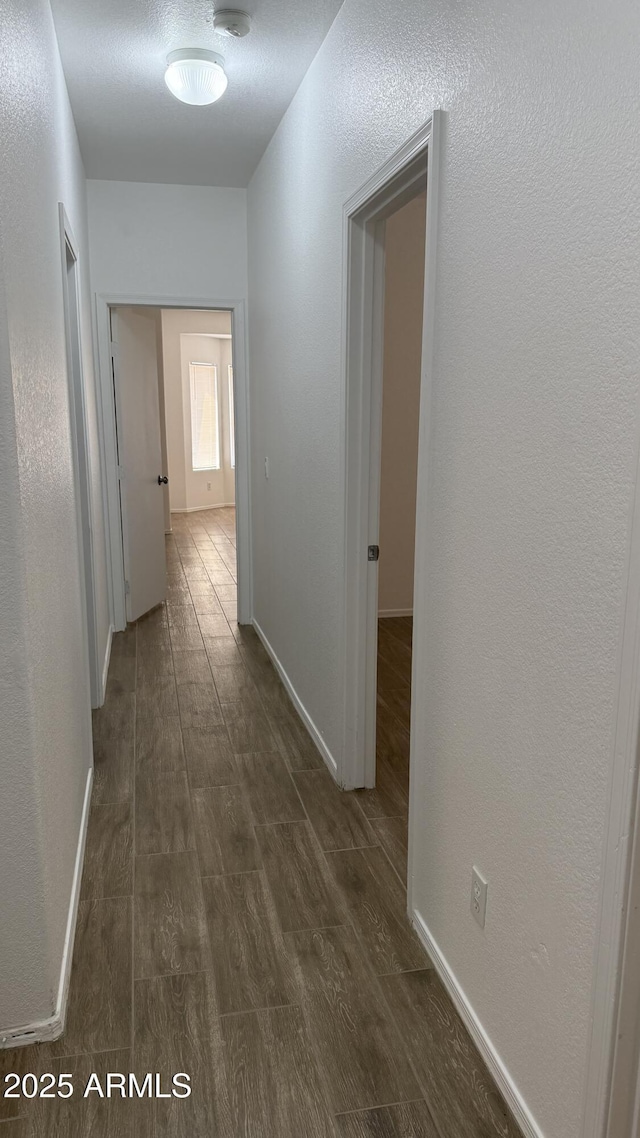 12505 W Adams St, Avondale, AZ 85323 - hallway with dark wood-style flooring