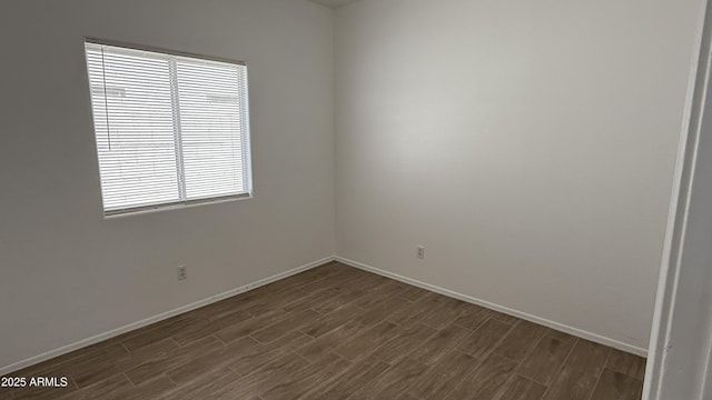 12505 W Adams St, Avondale, AZ 85323 - spare room with dark wood-type flooring and baseboards