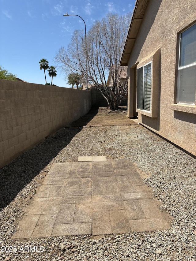 12505 W Adams St, Avondale, AZ 85323 - fenced backyard featuring a patio area