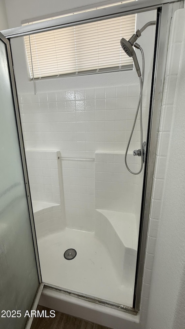 12505 W Adams St, Avondale, AZ 85323 - bathroom featuring a stall shower and wood finished floors
