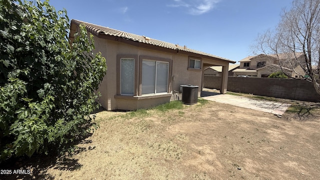 12505 W Adams St, Avondale, AZ 85323 - back of house with stucco siding, a patio, and a tiled roof