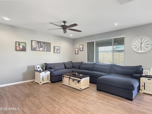 living room featuring recessed lighting, baseboards, light wood-type flooring, and a ceiling fan