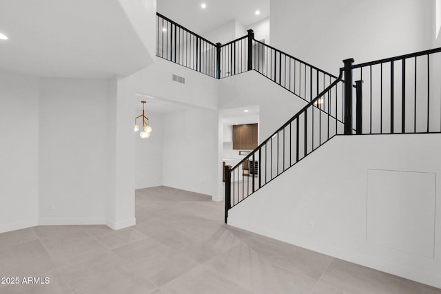 stairway with a towering ceiling