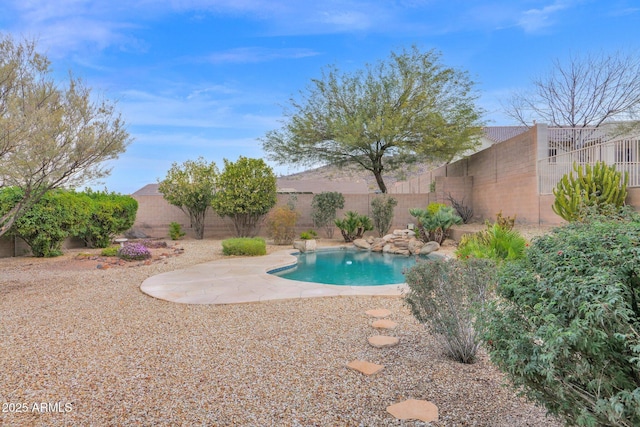 view of swimming pool with a patio area