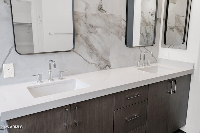 bathroom with tasteful backsplash and vanity