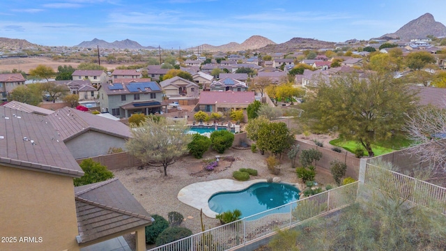 birds eye view of property with a mountain view