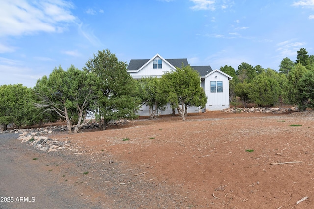 1305 N 22nd Ave, Show Low, AZ 85901 - view of front of house with crawl space and board and batten siding