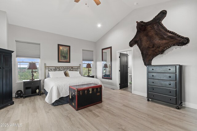 1305 N 22nd Ave, Show Low, AZ 85901 - bedroom featuring light wood-type flooring, high vaulted ceiling, ensuite bath, baseboards, and ceiling fan