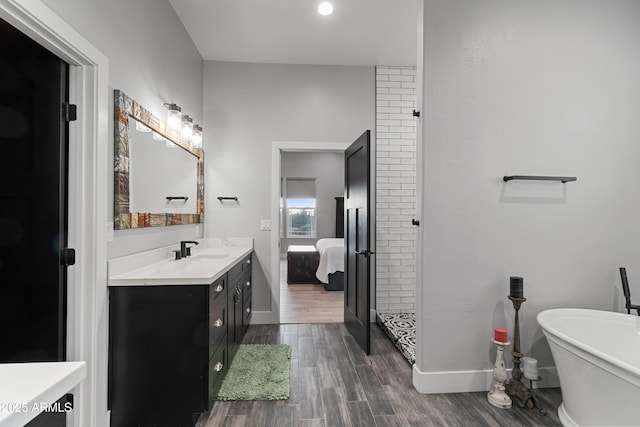 1305 N 22nd Ave, Show Low, AZ 85901 - ensuite bathroom featuring vanity, baseboards, wood finished floors, and a freestanding tub