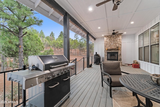 1305 N 22nd Ave, Show Low, AZ 85901 - wooden deck featuring an outdoor stone fireplace and ceiling fan