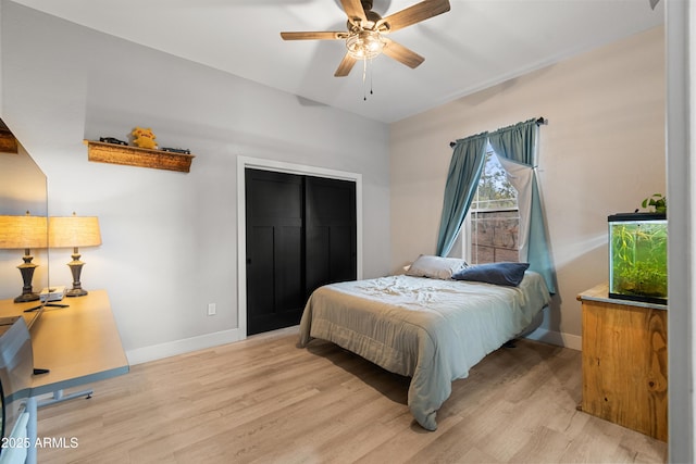 1305 N 22nd Ave, Show Low, AZ 85901 - bedroom featuring baseboards, light wood-type flooring, a closet, and a ceiling fan
