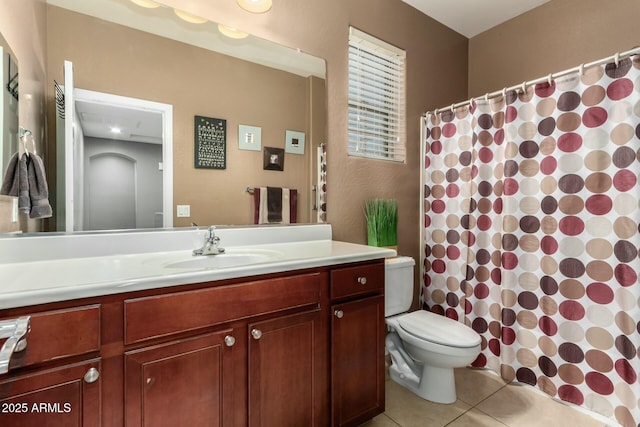 full bathroom featuring vanity, toilet, a shower with curtain, and tile patterned flooring