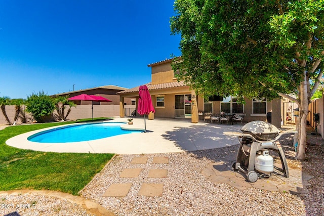 view of swimming pool with a patio, a fenced in pool, and a fenced backyard
