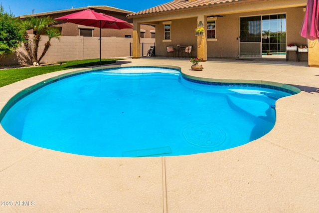 view of pool with fence, a fenced in pool, and a patio area