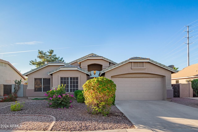 ranch-style home featuring a garage