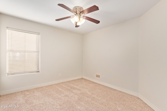 carpeted empty room with ceiling fan