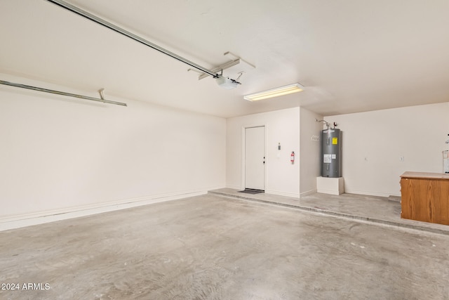 garage with electric water heater and a garage door opener