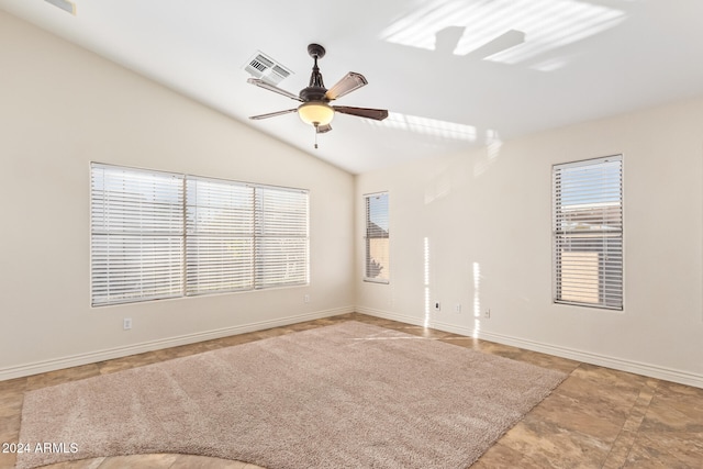 spare room with ceiling fan and lofted ceiling