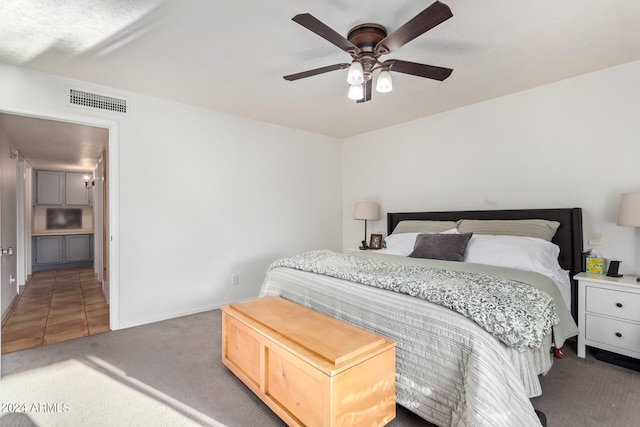 carpeted bedroom with ceiling fan