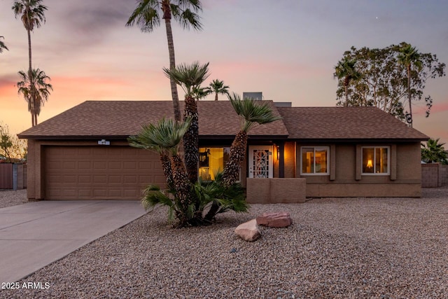 6424 E Aire Libre Ln, Scottsdale, AZ 85254 - view of front facade with a garage, concrete driveway, and roof with shingles