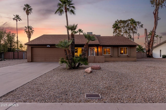 6424 E Aire Libre Ln, Scottsdale, AZ 85254 - view of front of home featuring a garage, concrete driveway, and stucco siding