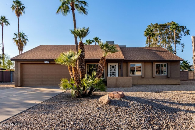 6424 E Aire Libre Ln, Scottsdale, AZ 85254 - ranch-style house with an attached garage, driveway, roof with shingles, and stucco siding