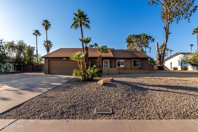 6424 E Aire Libre Ln, Scottsdale, AZ 85254 - ranch-style house featuring a garage, concrete driveway, and stucco siding