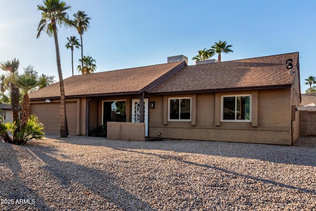 6424 E Aire Libre Ln, Scottsdale, AZ 85254 - ranch-style house with a garage, stucco siding, a shingled roof, and driveway
