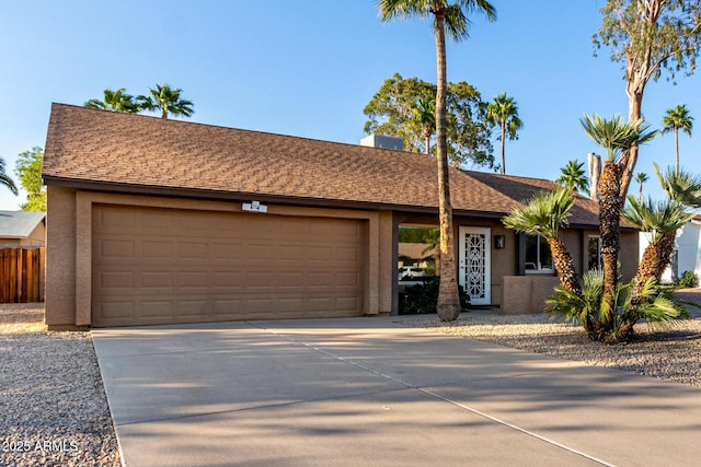 6424 E Aire Libre Ln, Scottsdale, AZ 85254 - ranch-style home featuring stucco siding, an attached garage, and driveway