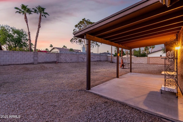 6424 E Aire Libre Ln, Scottsdale, AZ 85254 - yard at dusk featuring a patio and a fenced backyard
