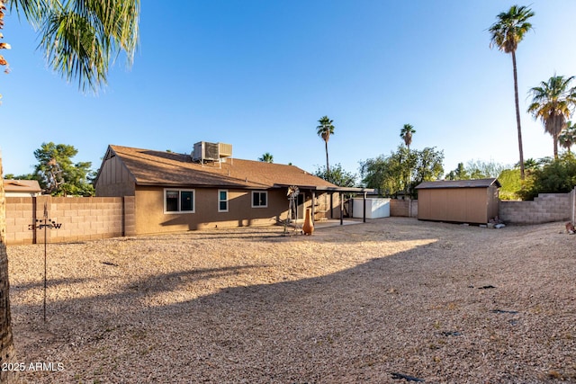 6424 E Aire Libre Ln, Scottsdale, AZ 85254 - back of house with a fenced backyard, a patio area, stucco siding, and central air condition unit