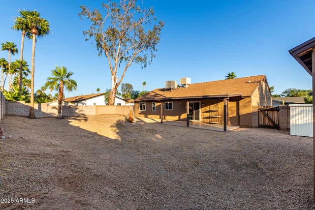 6424 E Aire Libre Ln, Scottsdale, AZ 85254 - back of property with a gate, a fenced backyard, and a patio area